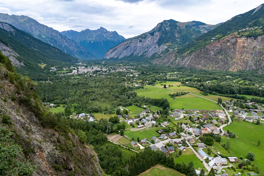 green grass field near mountain during daytime