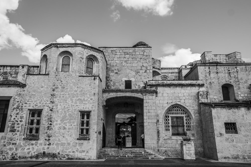 grayscale photo of brick building