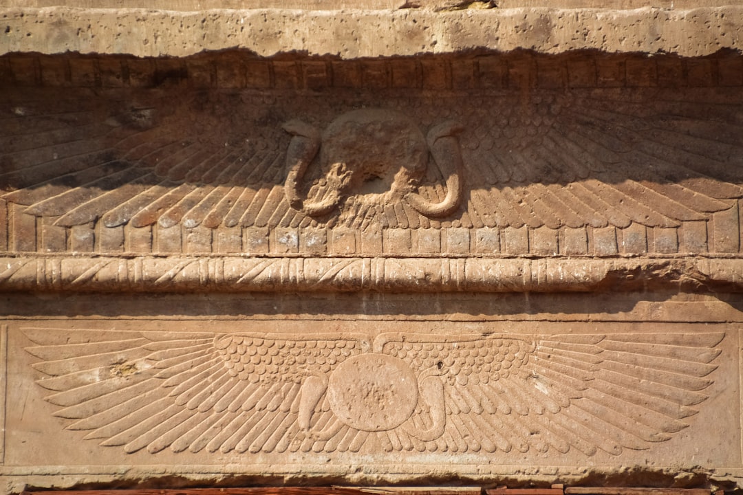 brown concrete wall with human face embossed