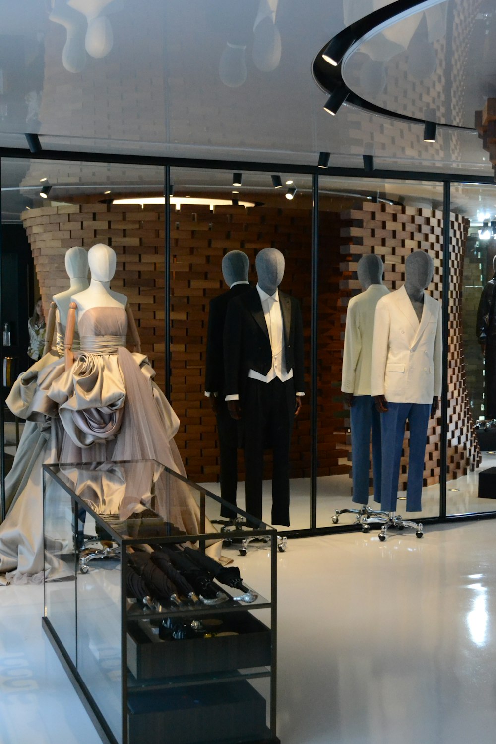 people in white dress standing on white floor tiles