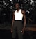 A model wearing a casual outfit made from organic cotton in a natural setting.