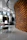 Interior view of a stylish commercial space featuring custom wooden furnishings by Artigianlegno.