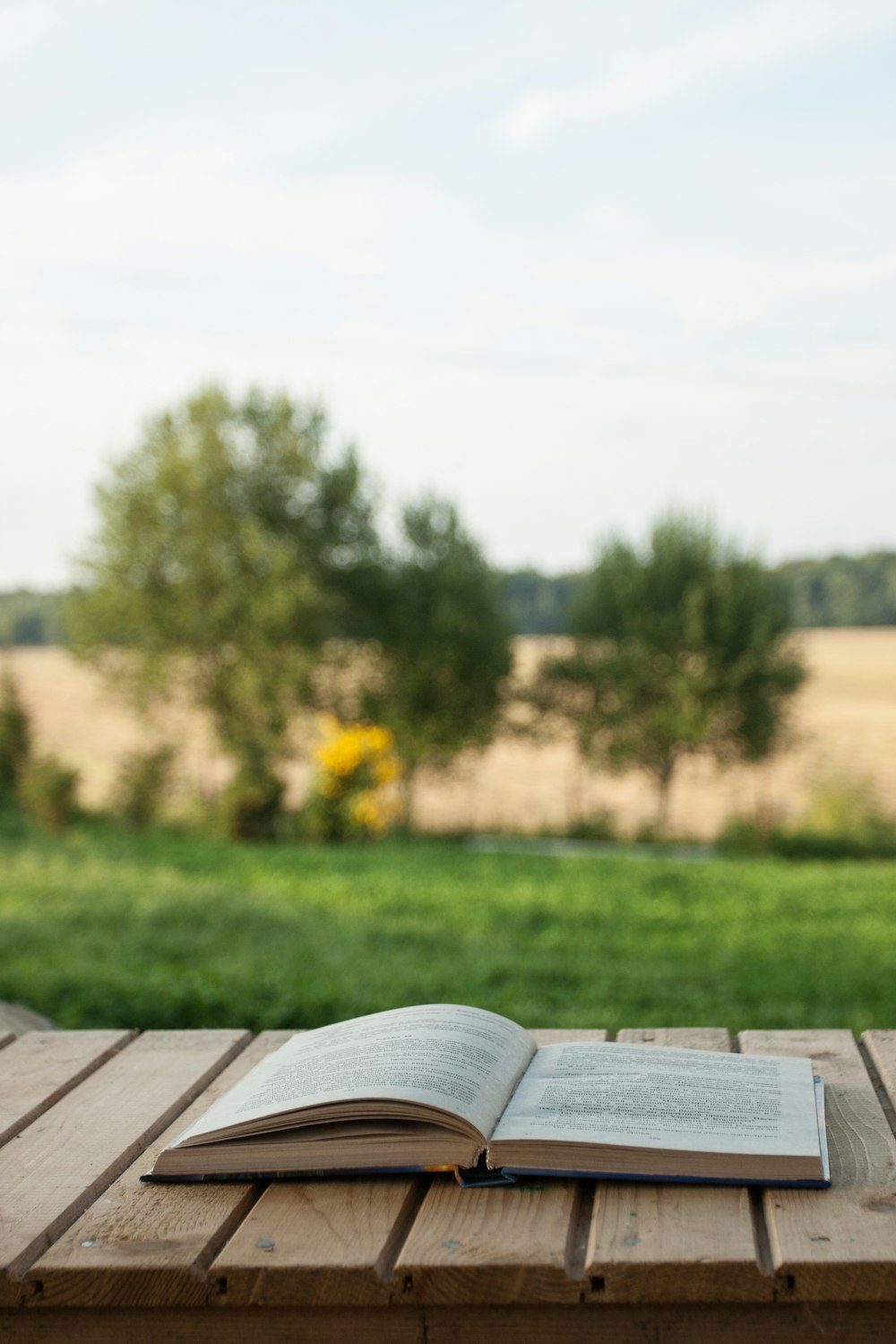 white book page on brown wooden table