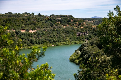 A scenic shot of the river setting where Nadikattu was filmed, with lush greenery.