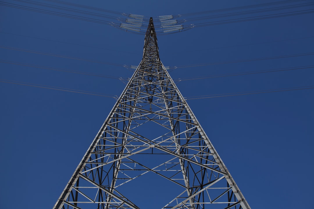 gray metal tower under blue sky during daytime