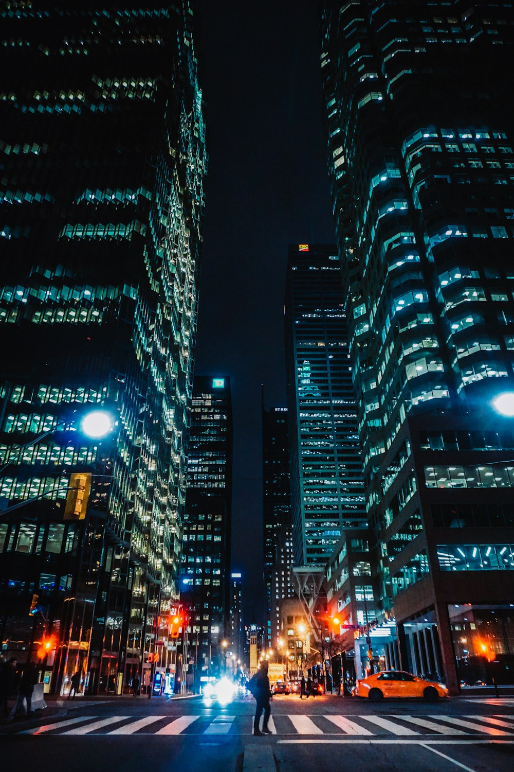 black and white city buildings during night time