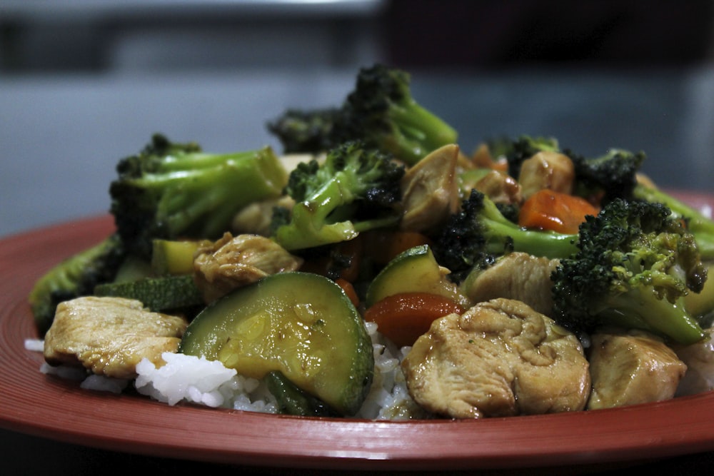 cooked food on red ceramic plate