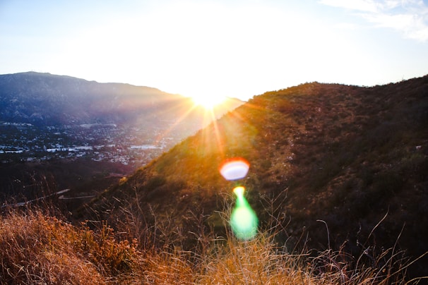 Sunset casting warm light over the Mendoza valley from a high viewpoint.