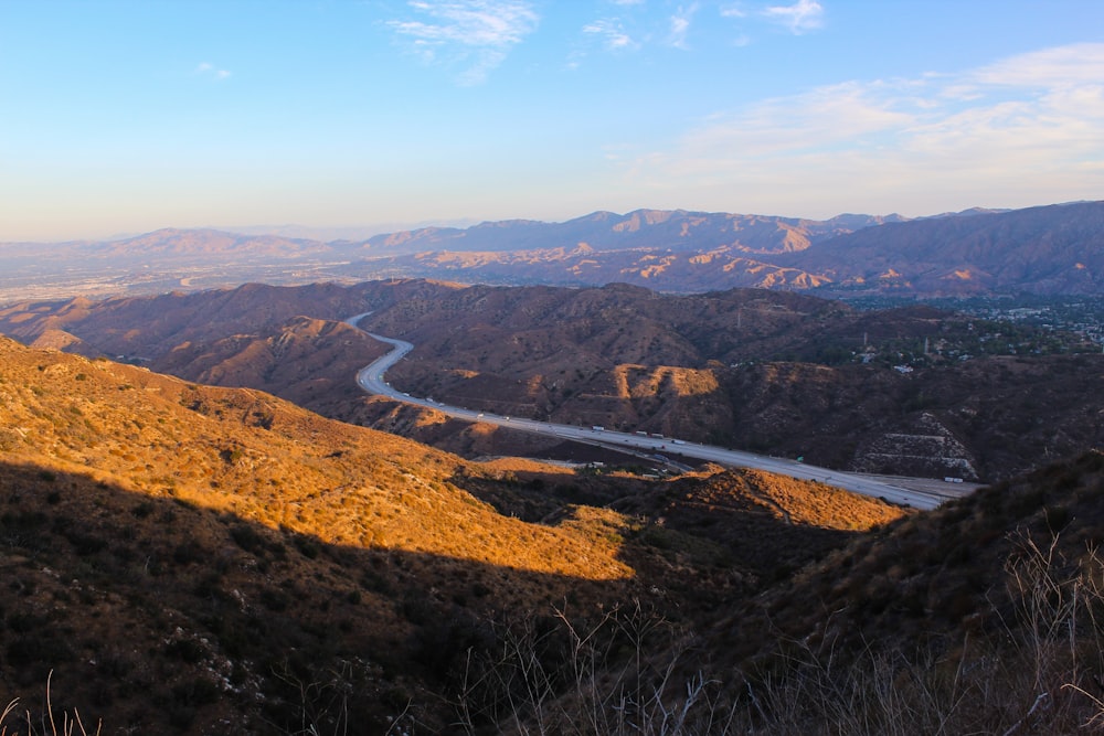 aerial view of green and brown mountains during daytime