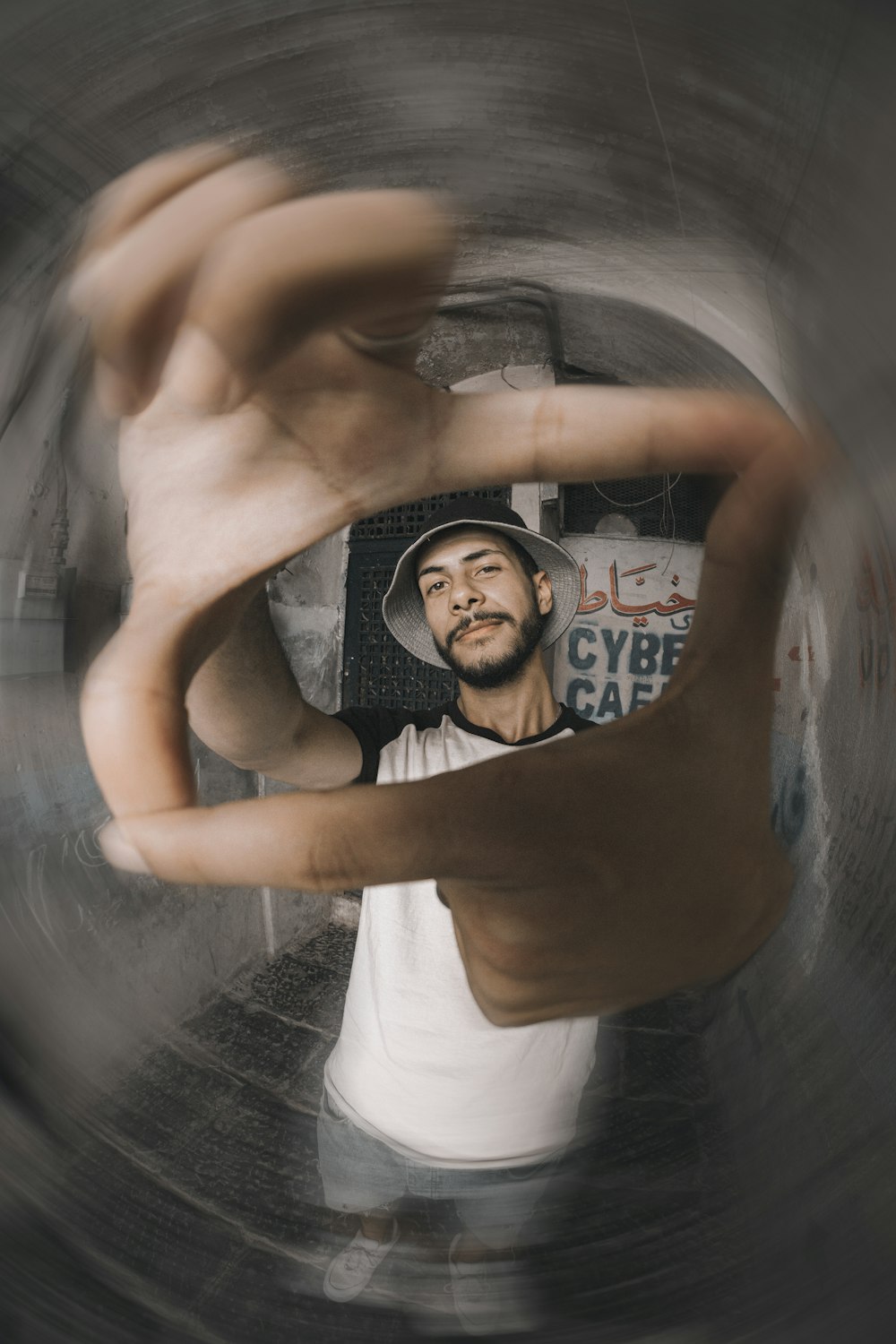 man in white tank top and black framed eyeglasses