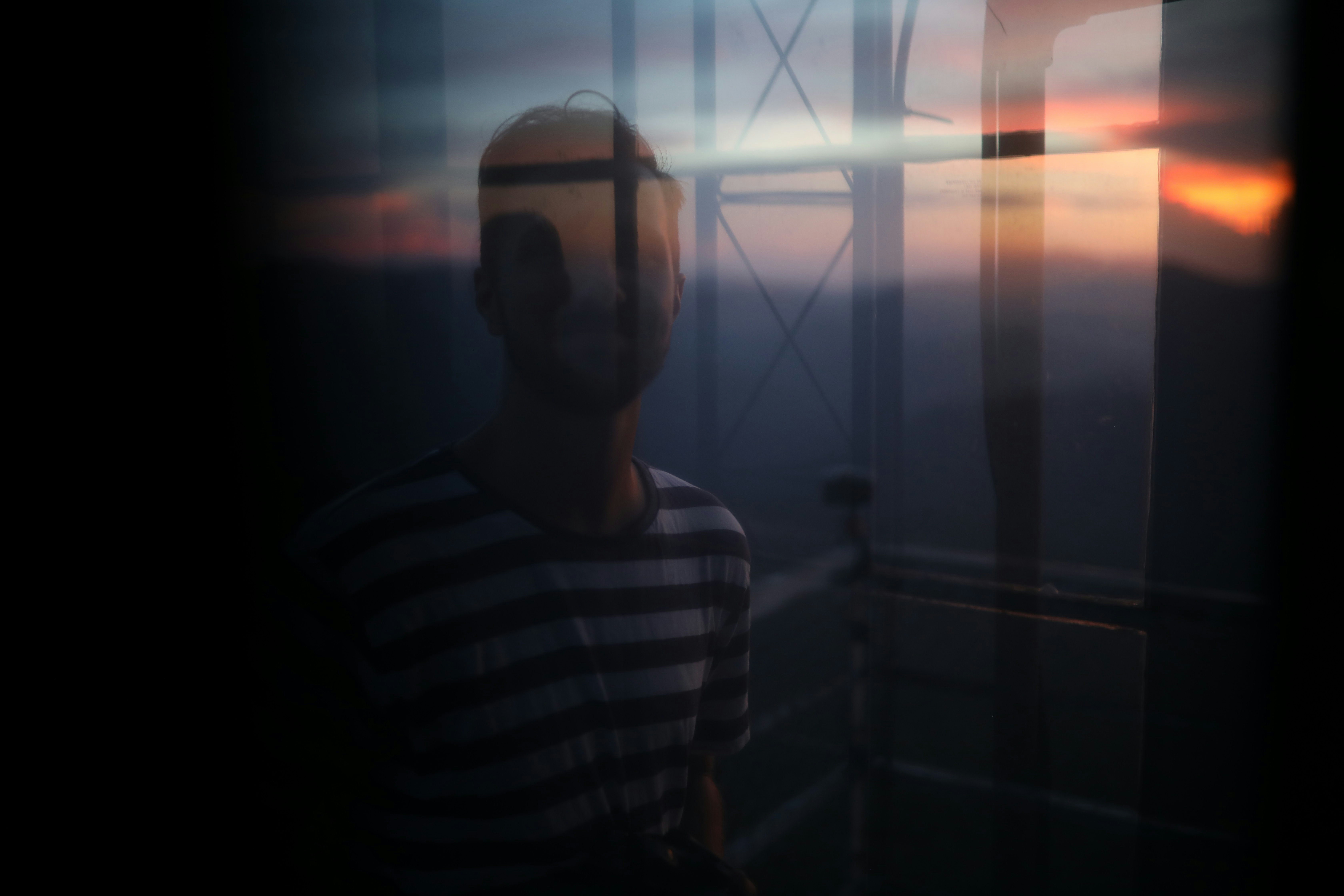 man in white and black striped crew neck shirt