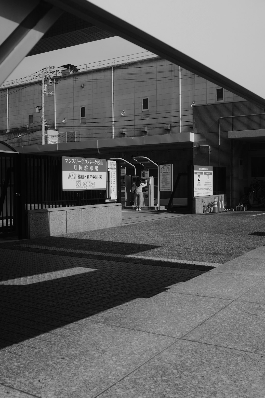 grayscale photo of building with glass window