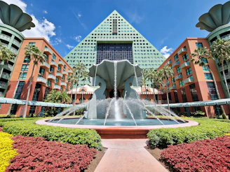 water fountain in front of brown building