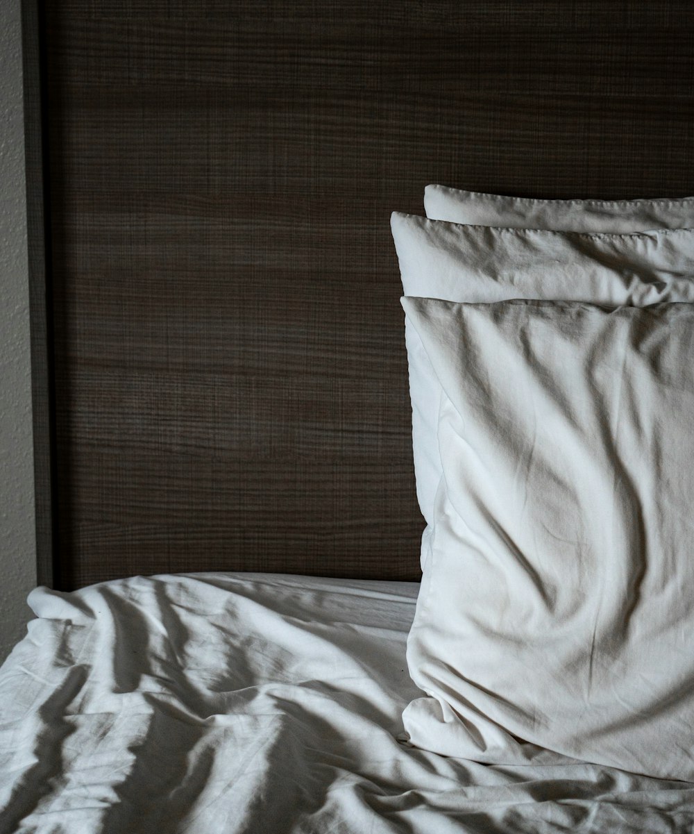 white pillow on white bed