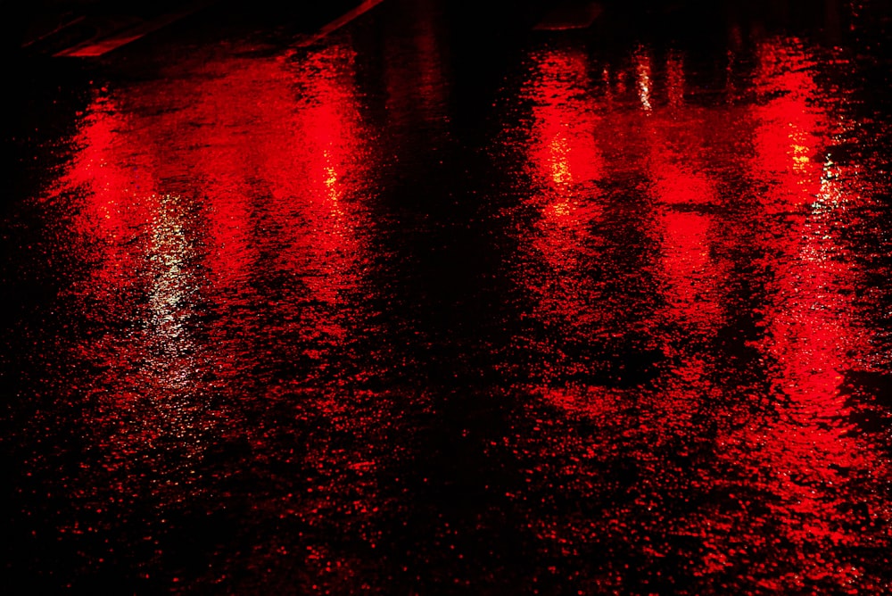 red and black body of water during night time