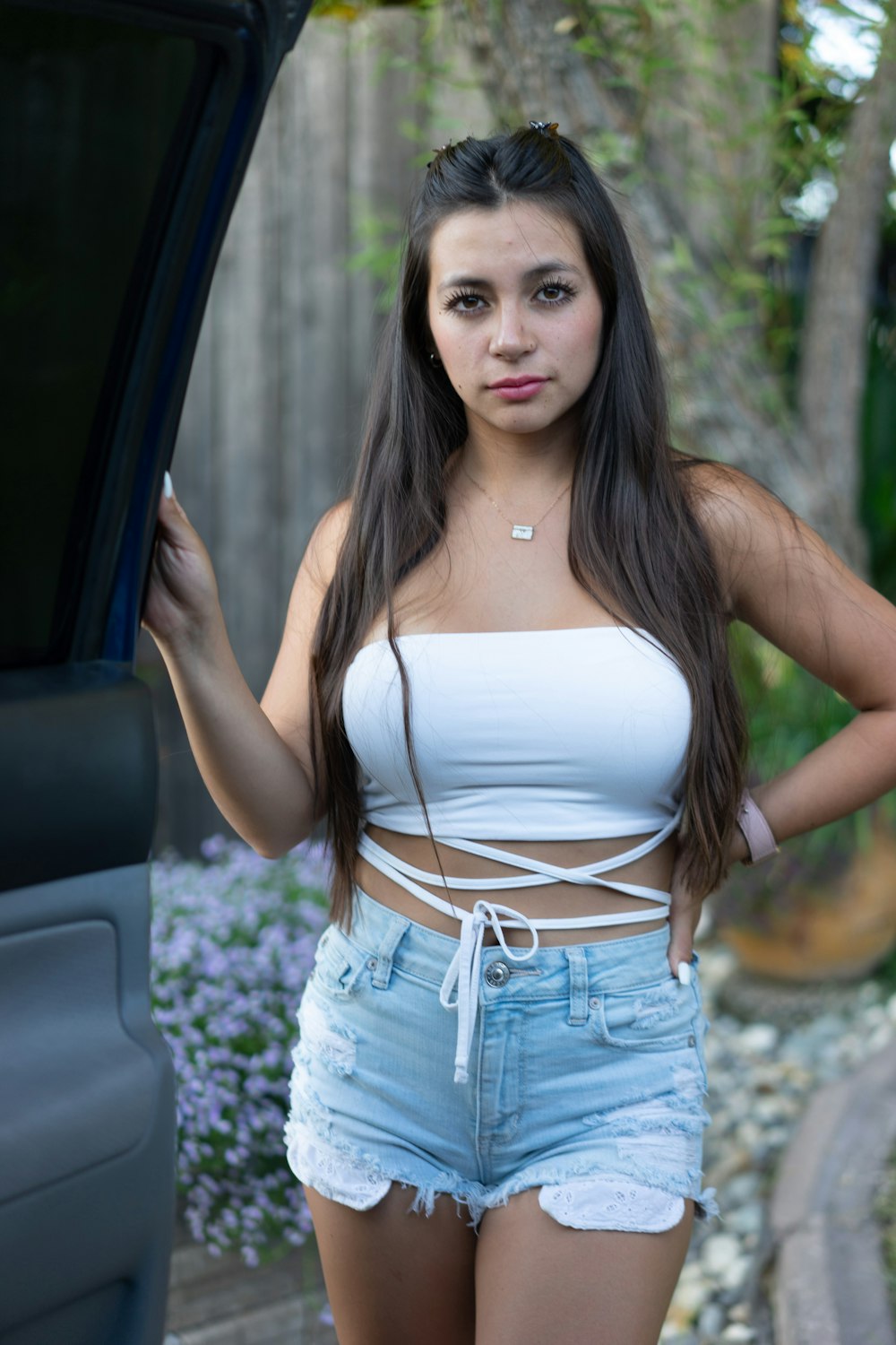 Woman in white tank top and blue denim shorts photo – Free Person Image on  Unsplash
