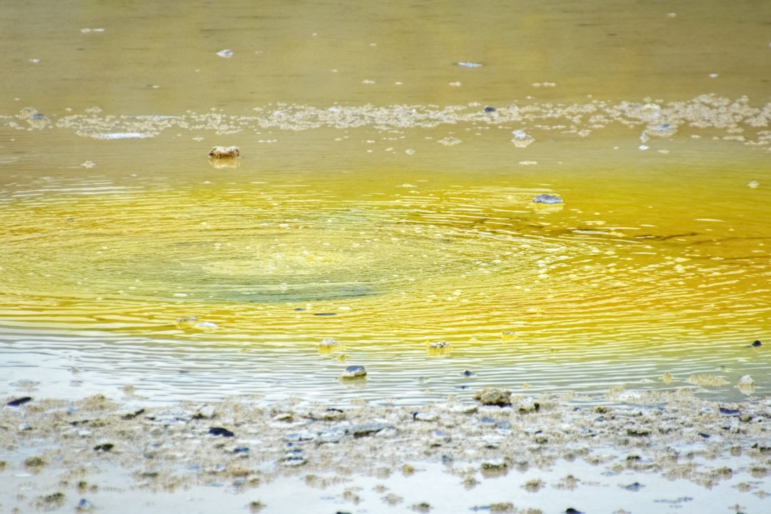 water wave on the shore during daytime