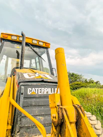 Close-up of a yellow Caterpillar excavator working on a construction site in Panama.