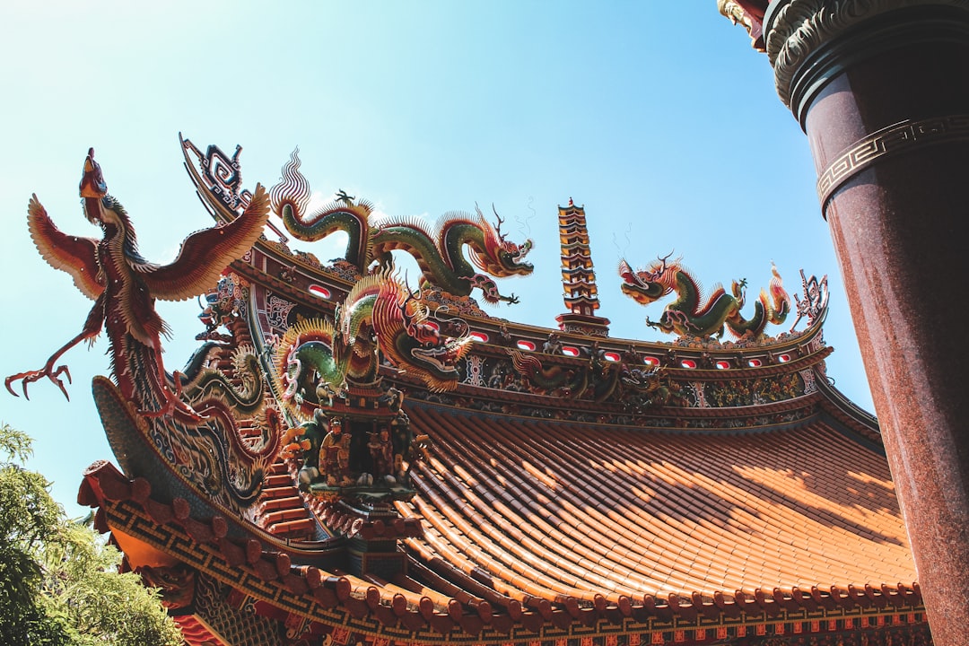 brown and green temple under blue sky during daytime