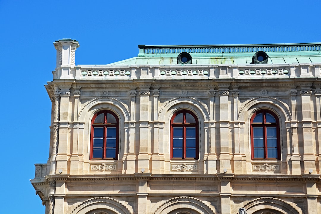 beige concrete building under blue sky during daytime