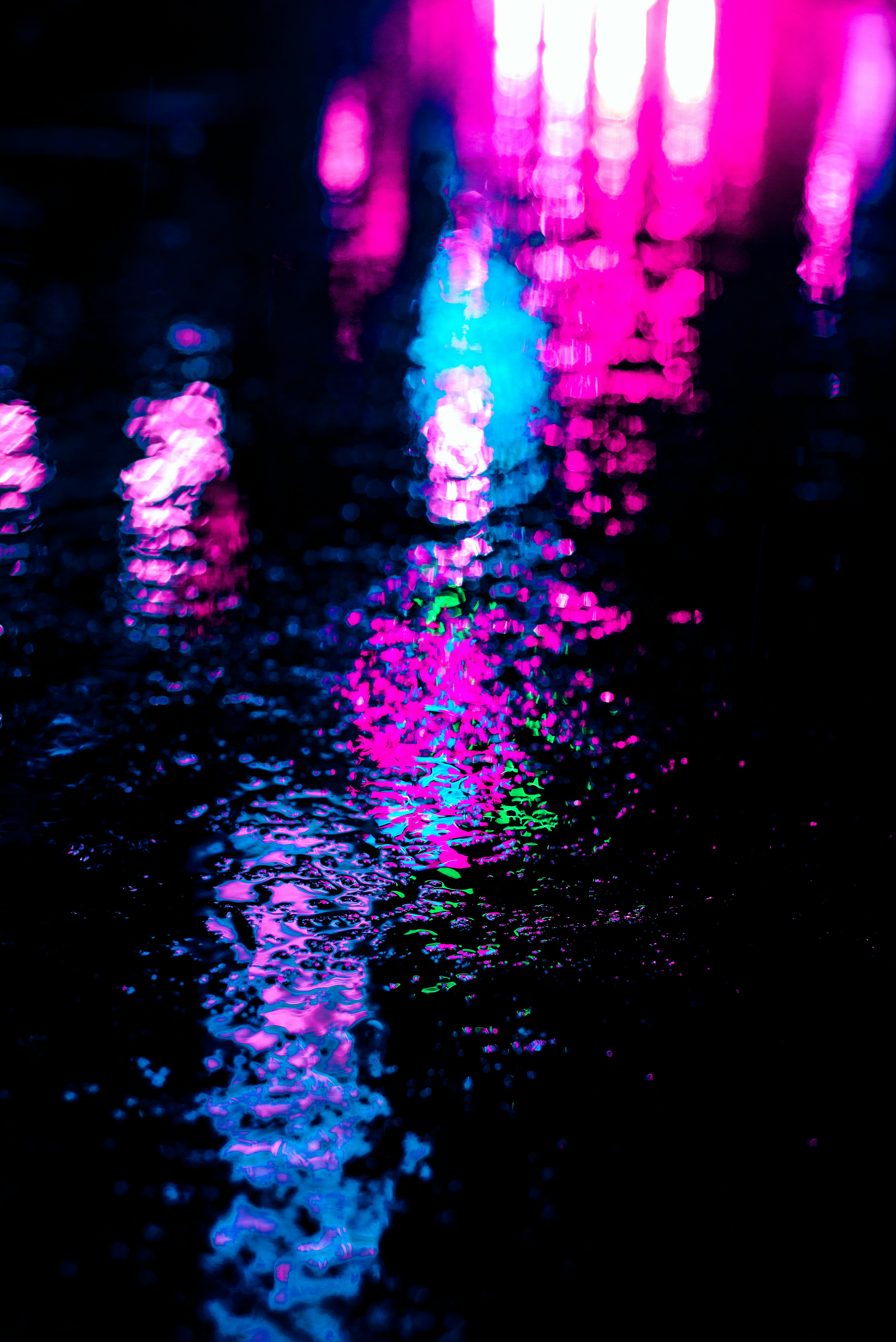 pink and blue lights on black background