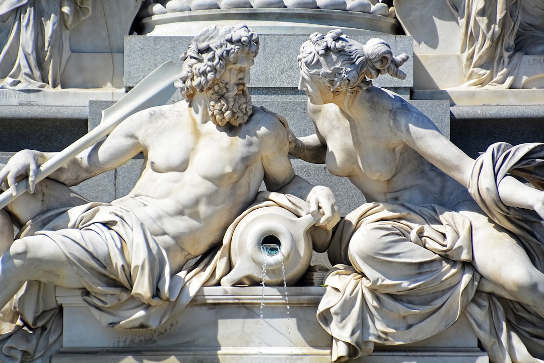 man and woman statue during daytime