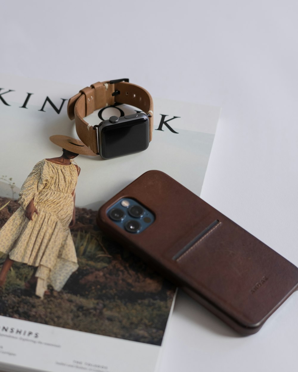 black and silver iphone on brown wooden table