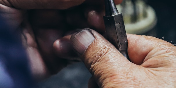 person holding black and silver pen