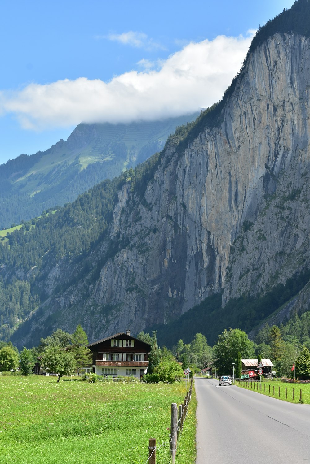 brown wooden house near mountain during daytime