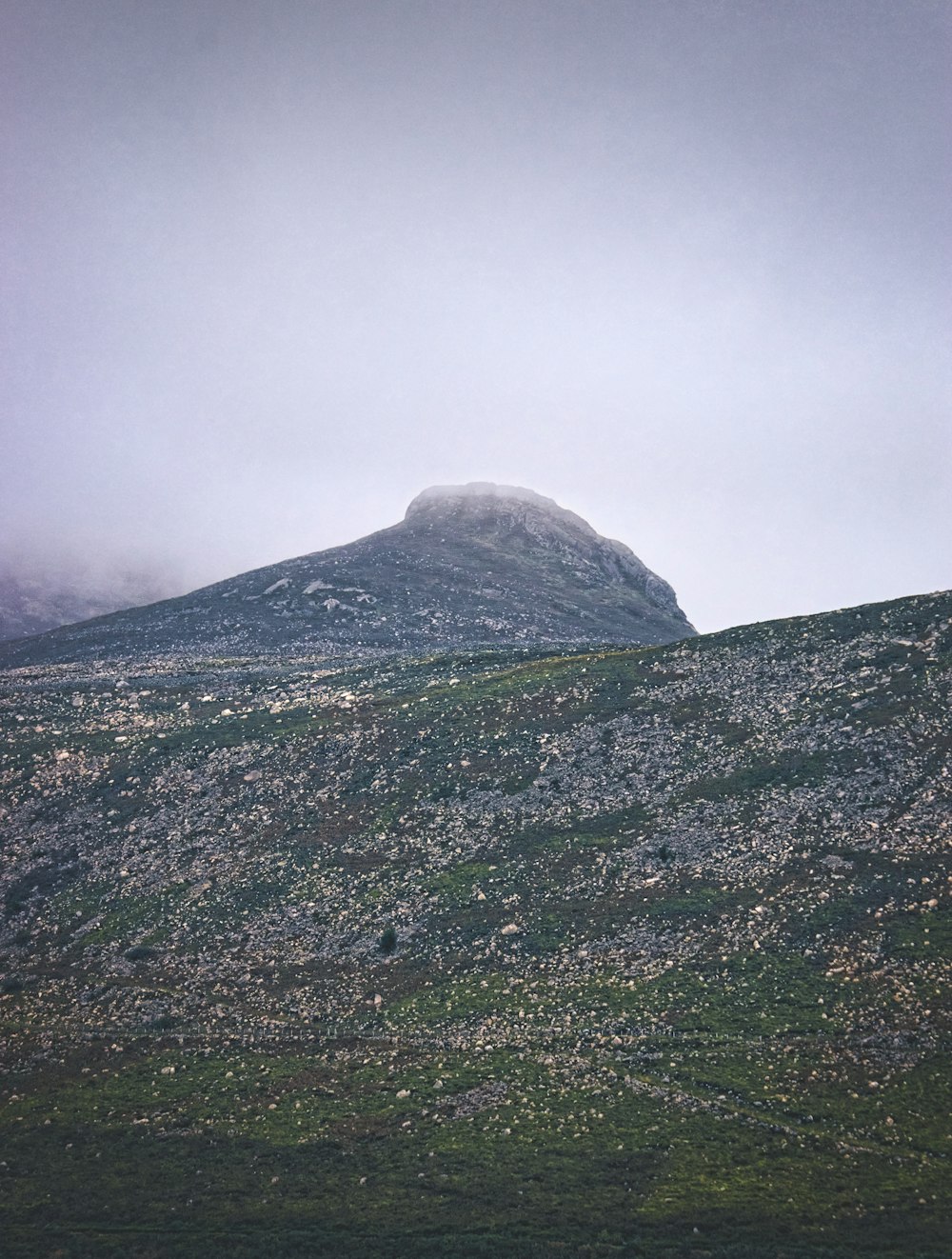 green and white mountain under white sky during daytime