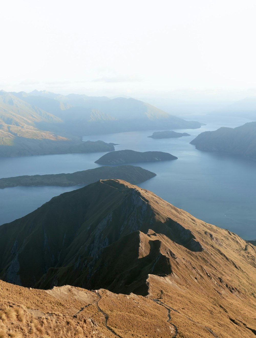 aerial view of lake and mountains during daytime