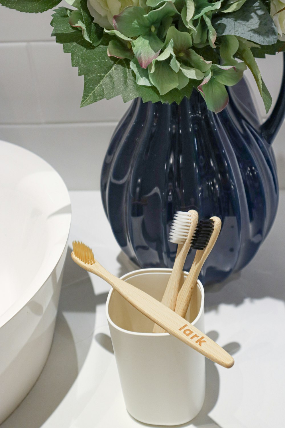 brown wooden chopsticks on blue ceramic vase