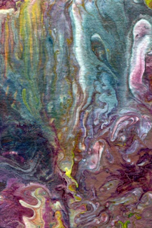 An abstract artwork mixing ocean blues and sun yellows in swirling patterns evoking fantasy.