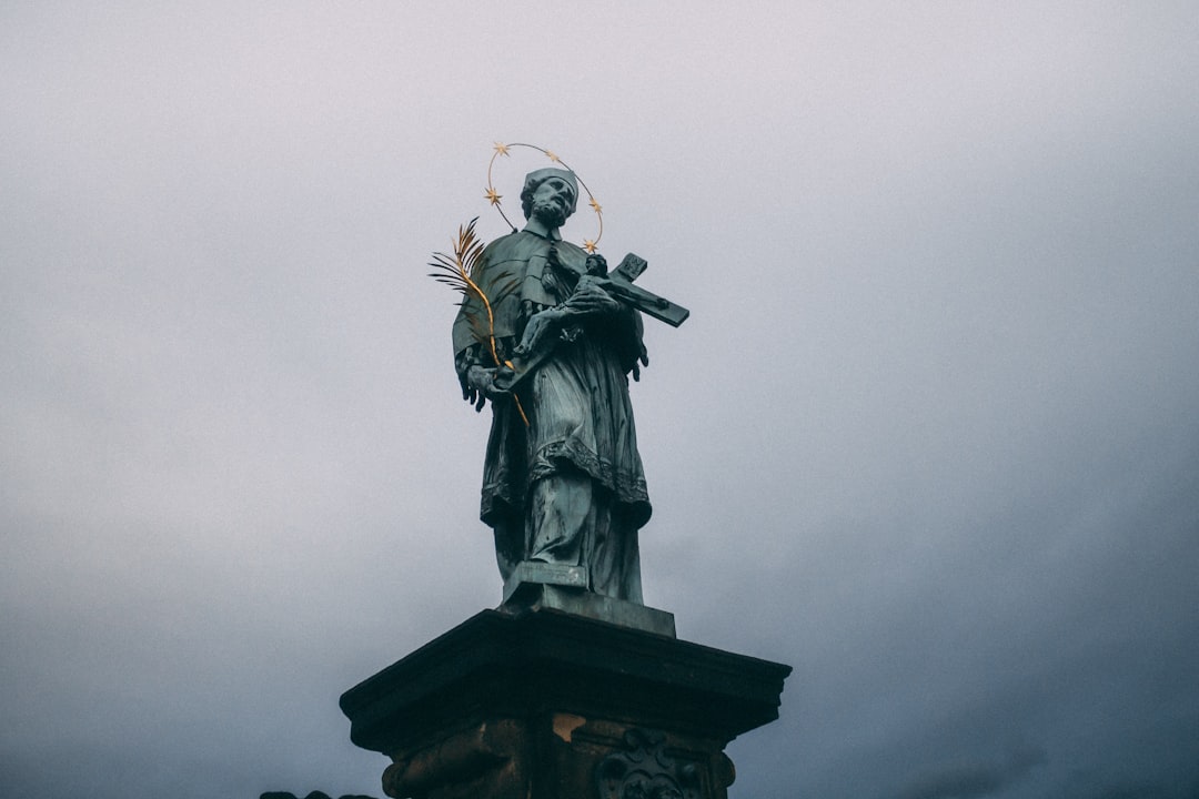 man in black coat statue