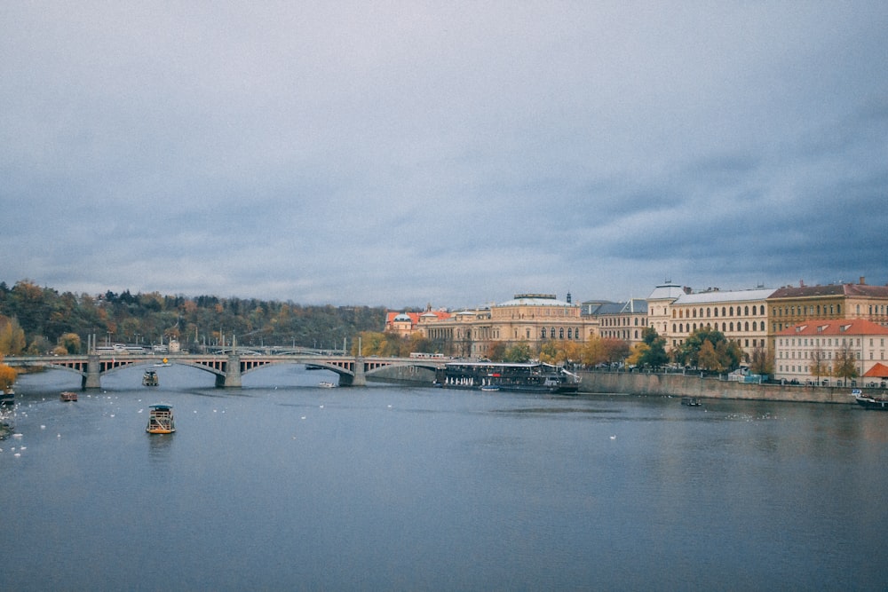 body of water near city buildings during daytime