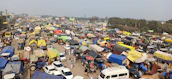 A diverse fleet of vehicles on the road, captured from an aerial view.