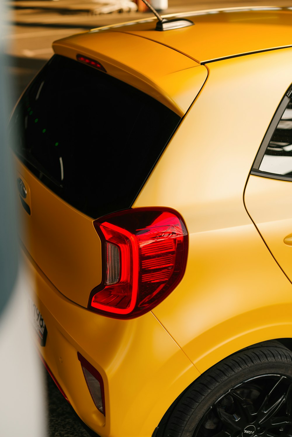 yellow and red car in close up photography