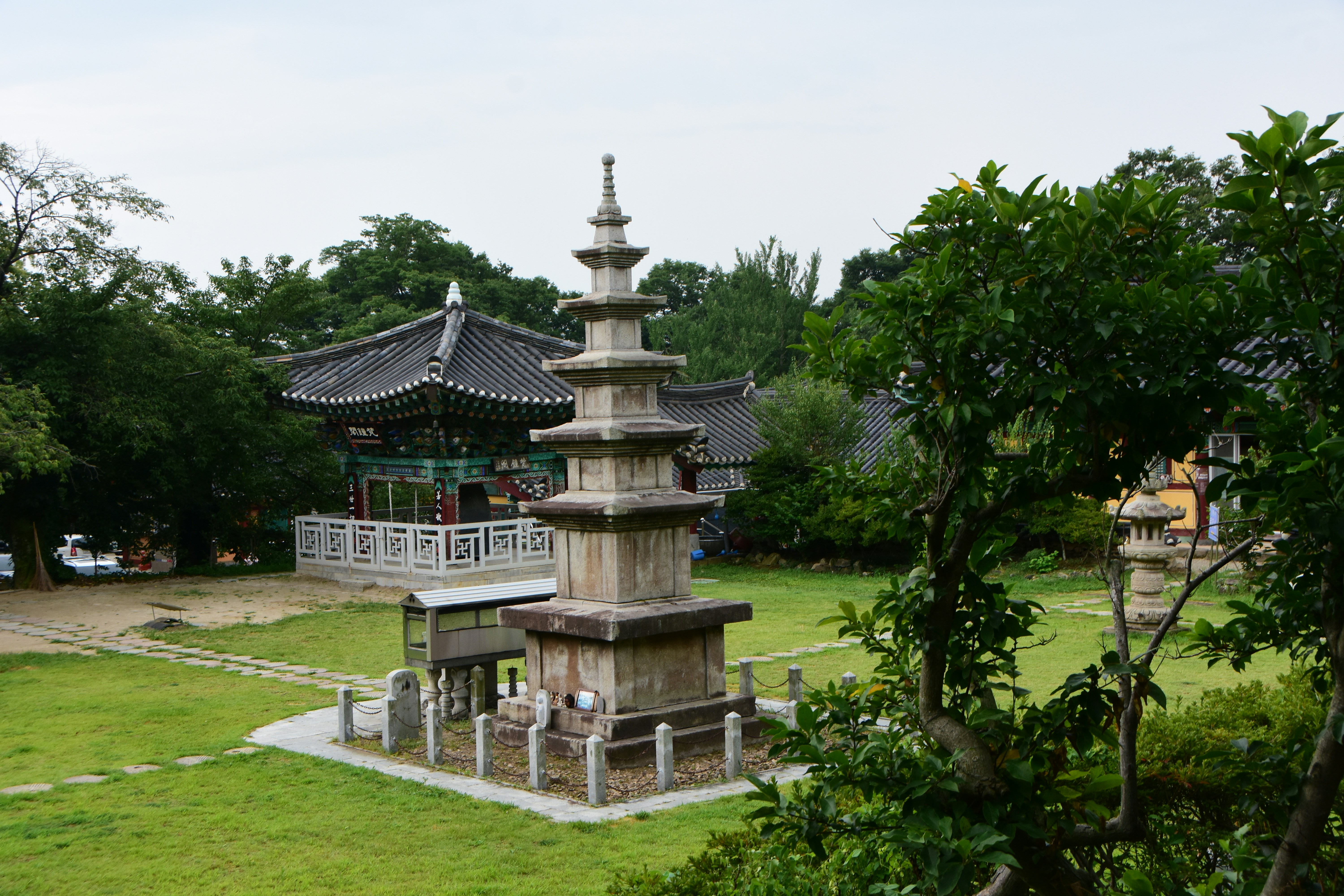 green trees near brown and white temple during daytime