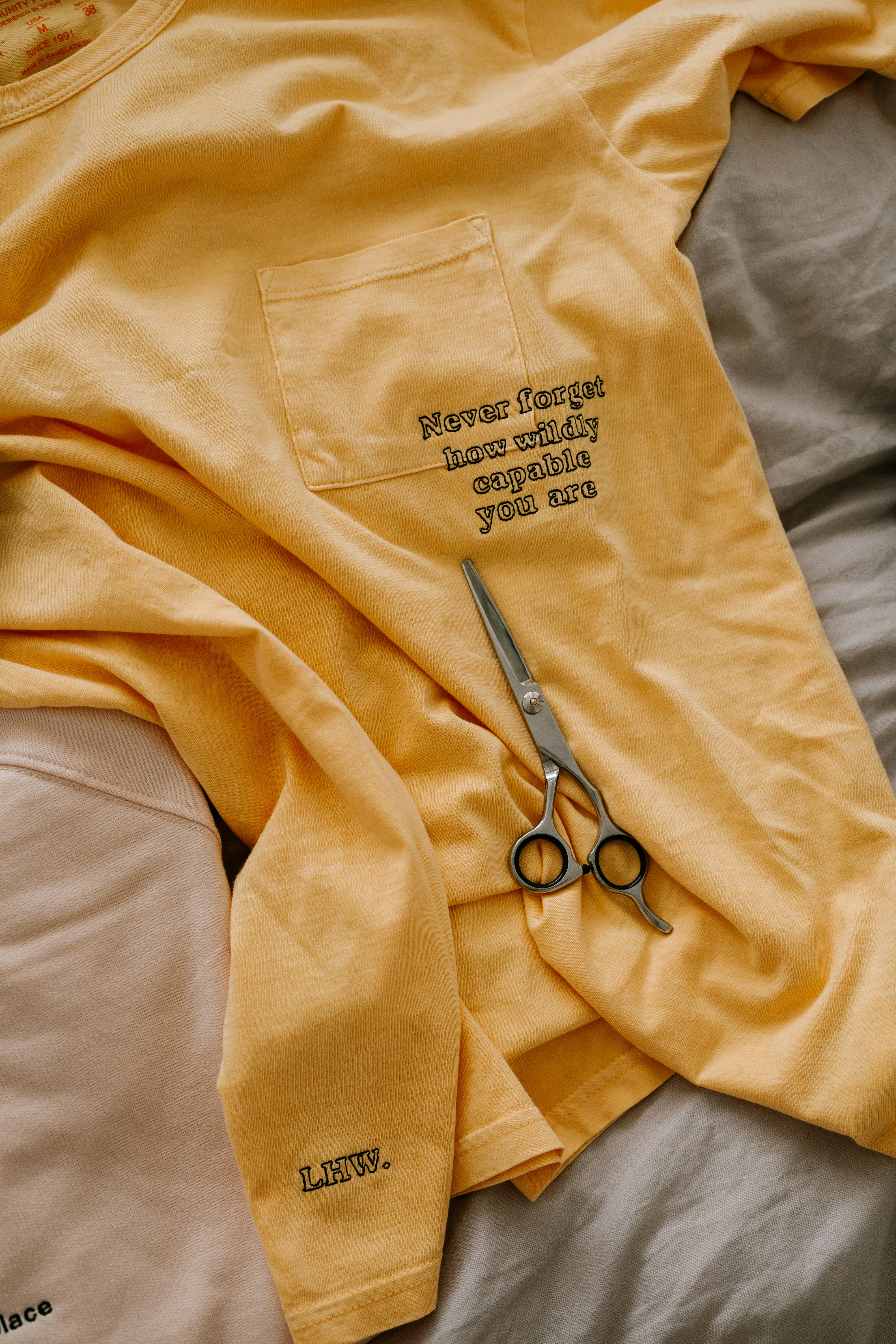 A collection of colorful custom printed t-shirts.