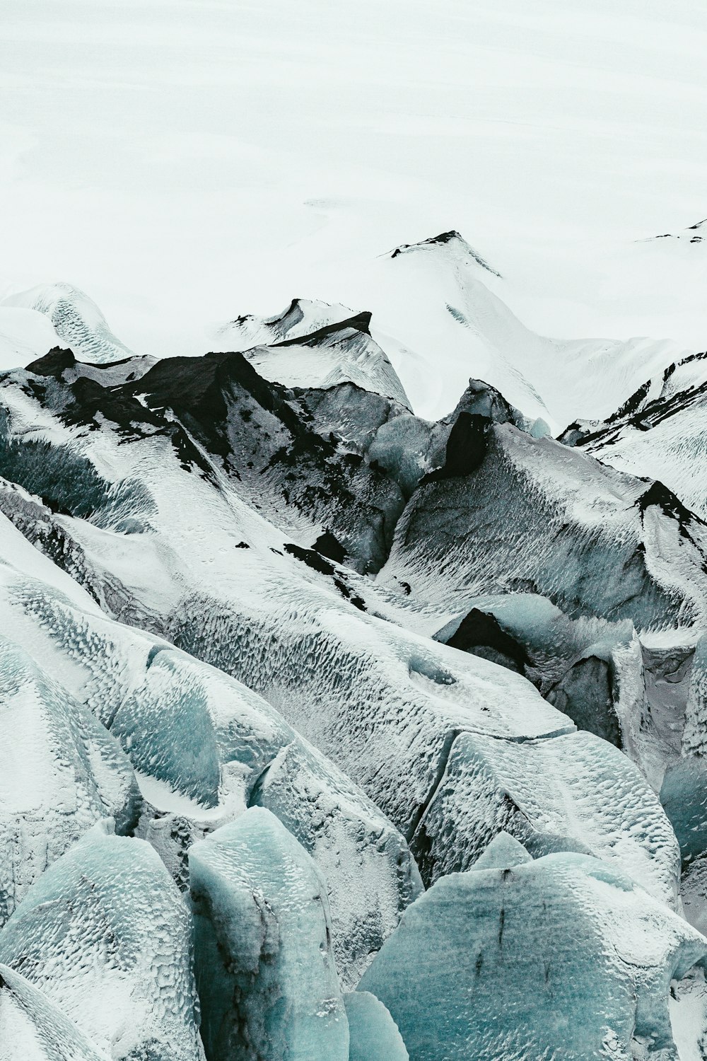 snow covered mountain during daytime