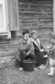 man and woman sitting on wooden bench