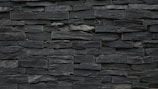 Slate walling stones installed on an exterior garden wall.