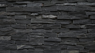 A variety of slate gray stonework products arranged aesthetically.