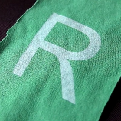 Close-up of a Riow hoodie fabric showing texture and subtle branding.