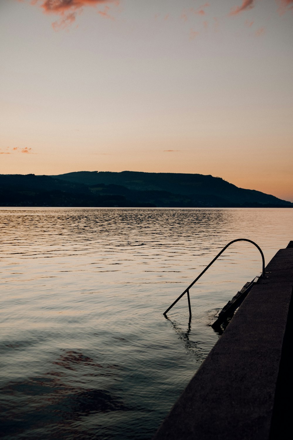 body of water during sunset