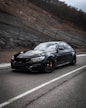 black bmw m 3 on road during daytime
