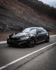 black bmw m 3 on road during daytime