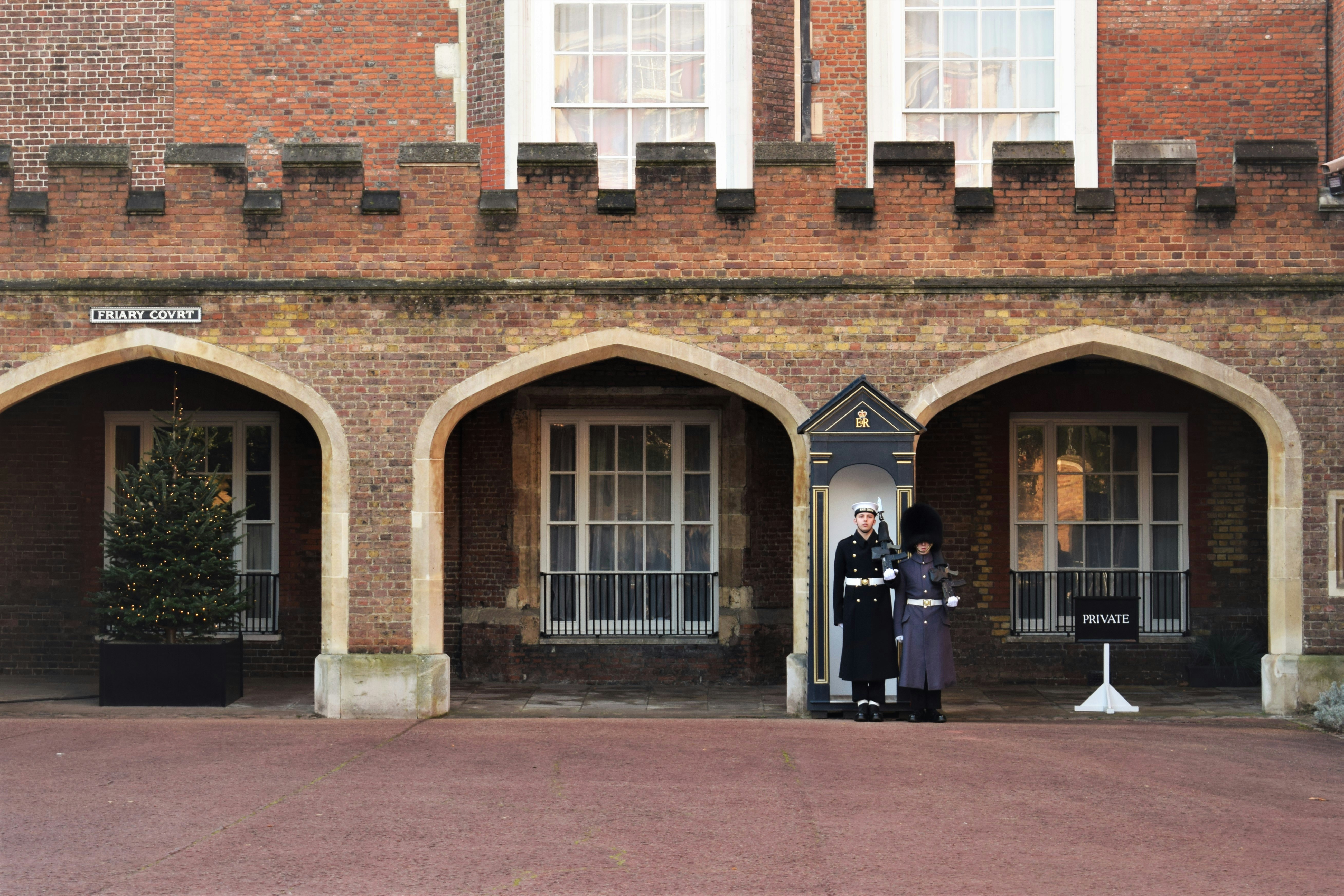 An industrial site secured by uniformed guards conducting thorough patrolling during the day.