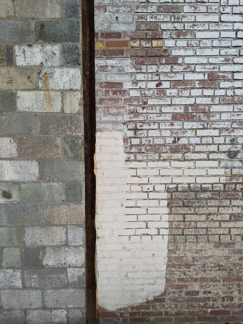 brown wooden frame on brick wall