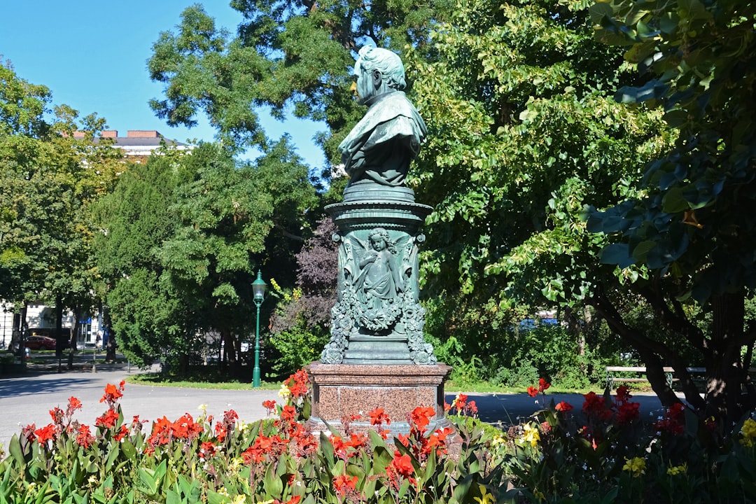 statue of man on a garden